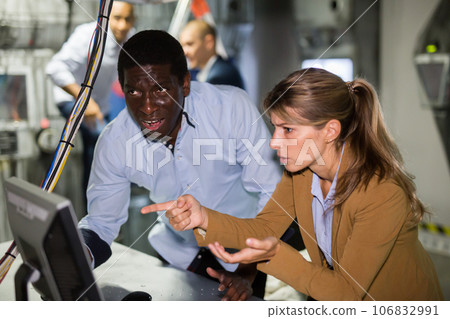 Young people solving conundrum in escape room Young people solving conundrum in escape room 106832991