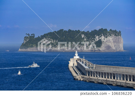 Baek Lighthouse and Beomseom Island, Gangjeong Port, Seogwipo, Jeju Island, South Korea seen from a large cruise ship Baek Lighthouse and Beomseom Island, Gangjeong Port, Seogwipo, Jeju Island, South Korea seen from a large cruise ship 106836220