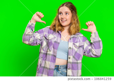 Young woman feeling very proud pointing herself overjoyed by success, making choice, self-confident Young woman feeling very proud pointing herself overjoyed by success, making choice, self-confident 106841259