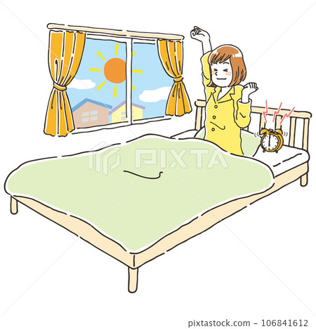A young woman wakes up refreshed in the morning in bed 106841612