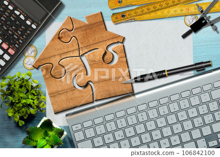 Wooden Jigsaw Puzzle Pieces Forming a House Shape Wooden Jigsaw Puzzle Pieces Forming a House Shape 106842100