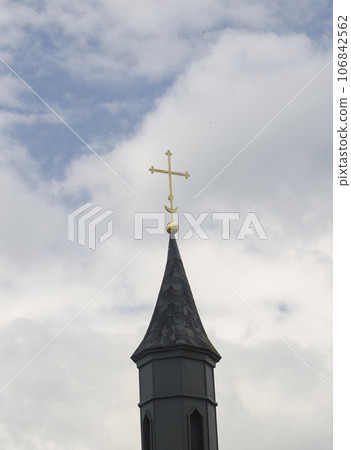 Christian cross and the stormy sky Christian cross and the stormy sky 106842562
