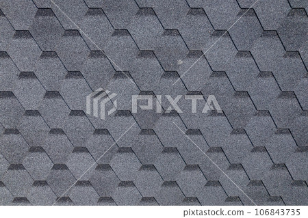 Shingles texture - close up view of asphalt roofing shingles Shingles texture - close up view of asphalt roofing shingles 106843735