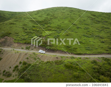 Car road trip on the high altitude mountain trail, China 106843841