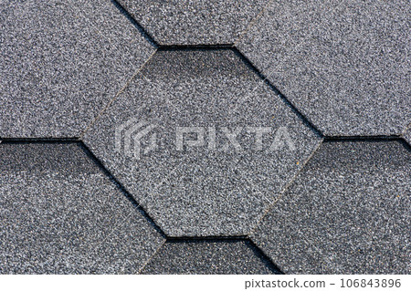 Shingles texture - close up view of asphalt roofing shingles Shingles texture - close up view of asphalt roofing shingles 106843896