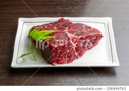 raw fin whale meat 106844763