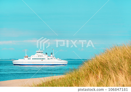 Summer scenery from Sylt island with boat navigating in North Sea, Germany 106847181