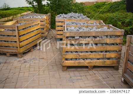 the remaining pieces of paving slabs on a wooden pallet after the completion of works on the improvement of the city 106847417