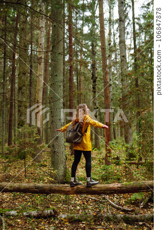 Happy woman enjoying green beautiful nature woods forest. Concept of healthy natural lifestyle. 106847878