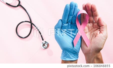 Holding pink ribbon 106848855