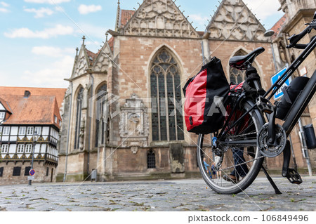 Braunschweig old market square cathedral church modern bikes travel luggage bag equipment parked european city center street. Healthy eco sustainable tourism family trip. Bike hobby adventure tour Braunschweig old market square cathedral church modern bikes travel luggage bag equipment parked european city center street. Healthy eco sustainable tourism family trip. Bike hobby adventure tour 106849496