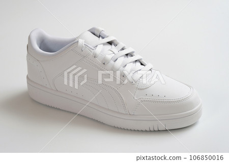 White shoes on a light background close-up. White shoes on a light background close-up. 106850016