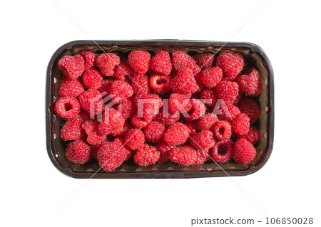 Ripe raspberries in a box on a white background, top view Ripe raspberries in a box on a white background, top view 106850028