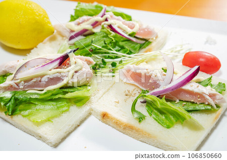 Making chicken tataki roll sandwich Making chicken tataki roll sandwich 106850660