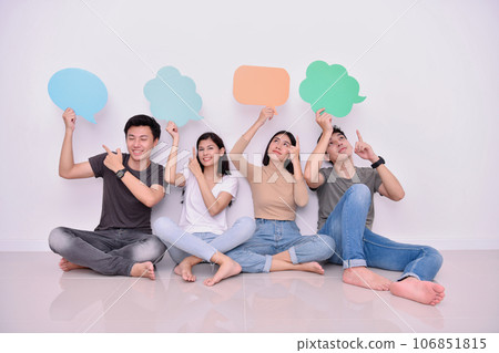 Asian man and woman holding a message frame on their head. They are expressing their creative imagination. Asian man and woman holding a message frame on their head. They are expressing their creative imagination. 106851815