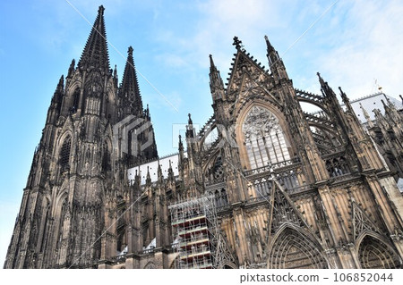 The magnificent and stately Cologne Cathedral (Germany) shines against the blue sky The magnificent and stately Cologne Cathedral (Germany) shines against the blue sky 106852044