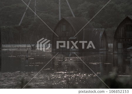 A submerged village where you can feel the brightness in the darkness 106852153