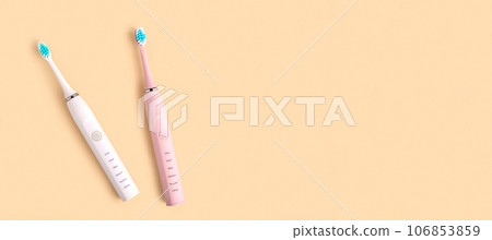 Electric Toothbrush. Top View, Flat Lay, Copy Space. Dental Care Supplies on Beige Pastel Studio Background. Oral Hygiene, Gum Health, Healthy Teeth. Modern Dental Ultrasonic Vibration Tooth Brush Set Electric Toothbrush. Top View, Flat Lay, Copy Space. Dental Care Supplies on Beige Pastel Studio Background. Oral Hygiene, Gum Health, Healthy Teeth. Modern Dental Ultrasonic Vibration Tooth Brush Set 106853859