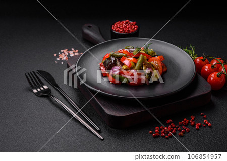 Delicious fresh salad of grilled vegetables peppers, tomatoes, eggplants and zucchini Delicious fresh salad of grilled vegetables peppers, tomatoes, eggplants and zucchini 106854957