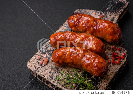 Delicious grilled chicken or pork sausages with salt, spices and herbs 106854976