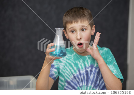 New scientific discoveries. Smart boy scientist screaming in surprise while doing chemical experiments in the laboratory. Education concept. Opening. 106855198
