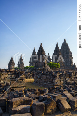 Prambanan temple and unrestored rubble (Yogyakarta, Indonesia) Prambanan temple and unrestored rubble (Yogyakarta, Indonesia) 106855990