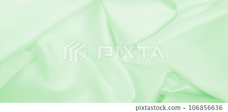 Smooth elegant green silk or satin luxury cloth texture as abstract background. Luxurious background design Smooth elegant green silk or satin luxury cloth texture as abstract background. Luxurious background design 106856636