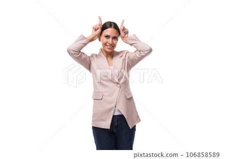 young beautiful business woman leader with a ponytail hairstyle dressed in a beige jacket makes a young beautiful business woman leader with a ponytail hairstyle dressed in a beige jacket makes a 106858589