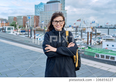 Mature woman tourist in Hamburg, posing in the river port 106859227