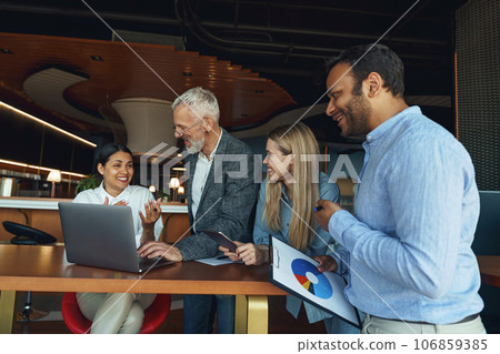 Group of people discussing daily plans in the office using laptop. Business teamwork situation 106859385