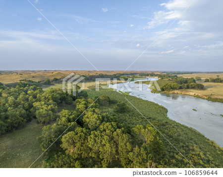 Dismal River meandering through Nebraska Sandhills at Nebraska National Forest, aerial view of late summer scenery 106859644