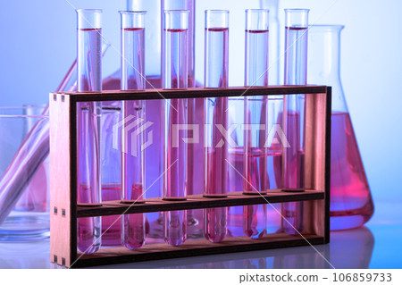 Chemical laboratory with glass test tubes and flasks Chemical laboratory with glass test tubes and flasks 106859733