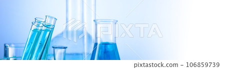 Chemical laboratory with glass test tubes and flasks 106859739