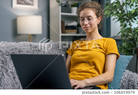 Working from home on laptop 106859979