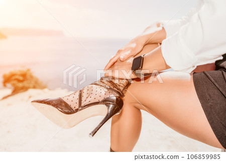 Woman sea laptop. Business woman in yellow hat freelancer with laptop working over blue sea beach. Girl relieves stress from work. Freelance, digital nomad, travel and holidays concept 106859985