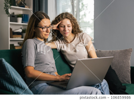 Women using laptop at leisure time Women using laptop at leisure time 106859986