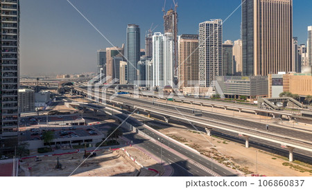Dubai Marina skyscrapers and Sheikh Zayed road with metro railway aerial timelapse, United Arab Emirates 106860837