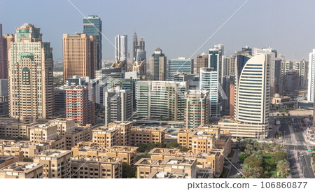 Skyscrapers in Barsha Heights district and low rise buildings in Greens district aerial all day timelapse. Dubai skyline Skyscrapers in Barsha Heights district and low rise buildings in Greens district aerial all day timelapse. Dubai skyline 106860877