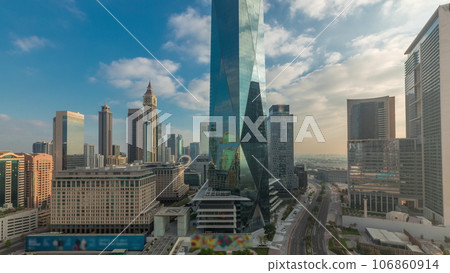 Dubai International Financial district aerial night to day timelapse. Panoramic view of business office towers. Dubai International Financial district aerial night to day timelapse. Panoramic view of business office towers. 106860914
