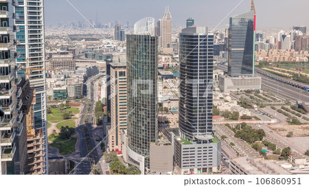 Aerial view of media city and al barsha heights district area all day timelapse from Dubai marina. 106860951