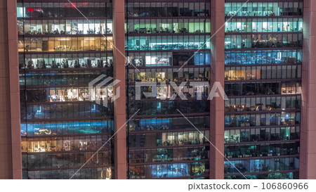 Big glowing windows in modern office and residential buildings day to night timelapse Big glowing windows in modern office and residential buildings day to night timelapse 106860966