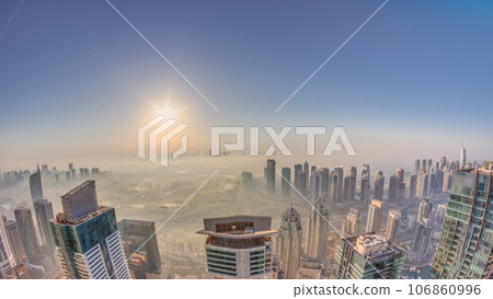 Panorama of Dubai Marina with JLT skyscrapers and golf course during sunrise timelapse, Dubai, United Arab Emirates. 106860996
