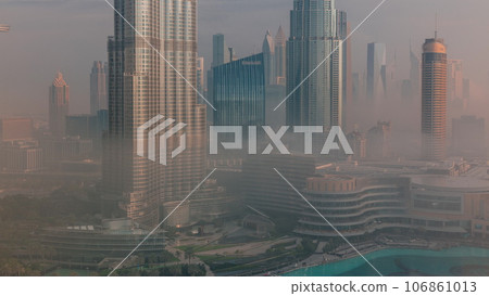 Aerial view of Dubai city early morning during fog timelapse. 106861013