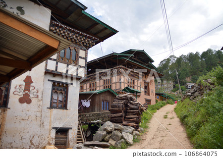 Bhutan, the land of happiness Villages and murals on the way to Chimi Lhakhang (Punakha, Bhutan) Bhutan, the land of happiness Villages and murals on the way to Chimi Lhakhang (Punakha, Bhutan) 106864075