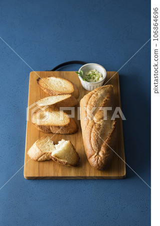 baguette and cutting board 106864696