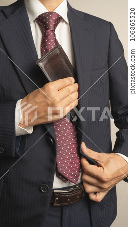 Businessman taking out his wallet 106865520