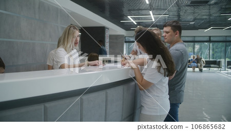 Family with little child make appointment with doctor in clinic 106865682