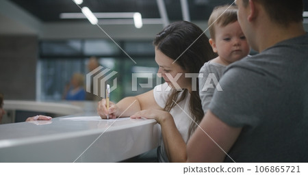 Family with little child make appointment with doctor in clinic Family with little child make appointment with doctor in clinic 106865721