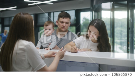 Family with little child make appointment with doctor in clinic 106865870