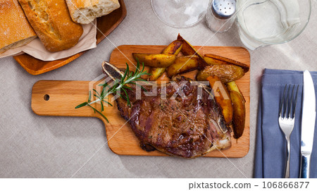 Entrecote with slices of baked potatoes Entrecote with slices of baked potatoes 106866877